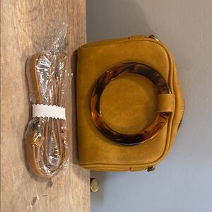 Anthropologie Tan and Brown Crossbody Bag with Circular Ring Detail